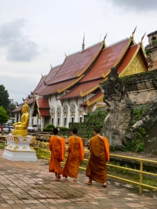 Monks strolling around Wat Chedi Luang